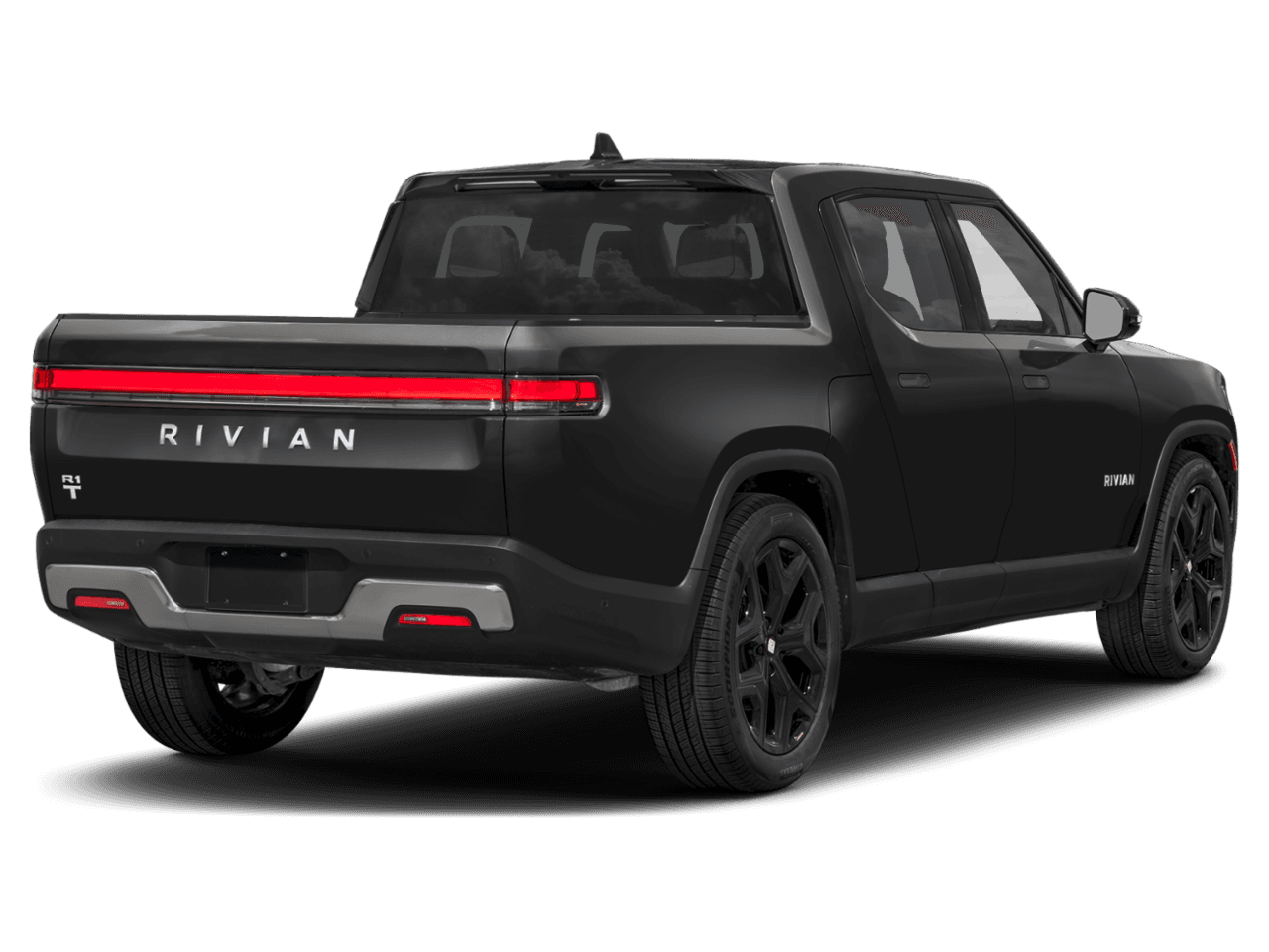 2025 Rivian R1T Adventure - Rear 3/4, facing to the right