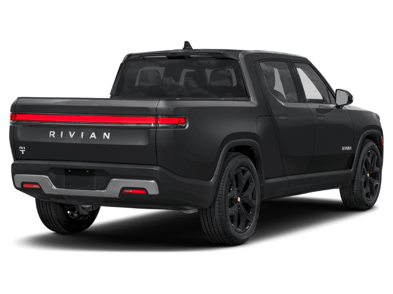 2025 Rivian R1T Ascend - Rear 3/4, facing to the right