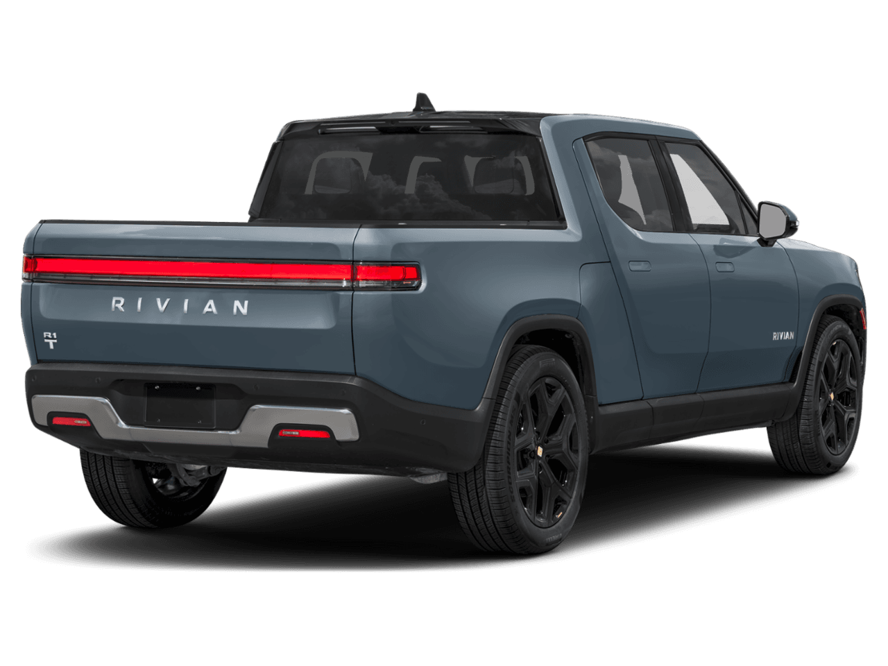 2025 Rivian R1T Ascend - Rear 3/4, facing to the right